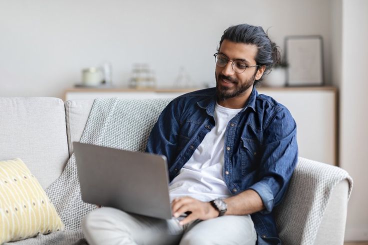Remote Work_ Handsome Eastern Freelancer Guy Working With Laptop At Home